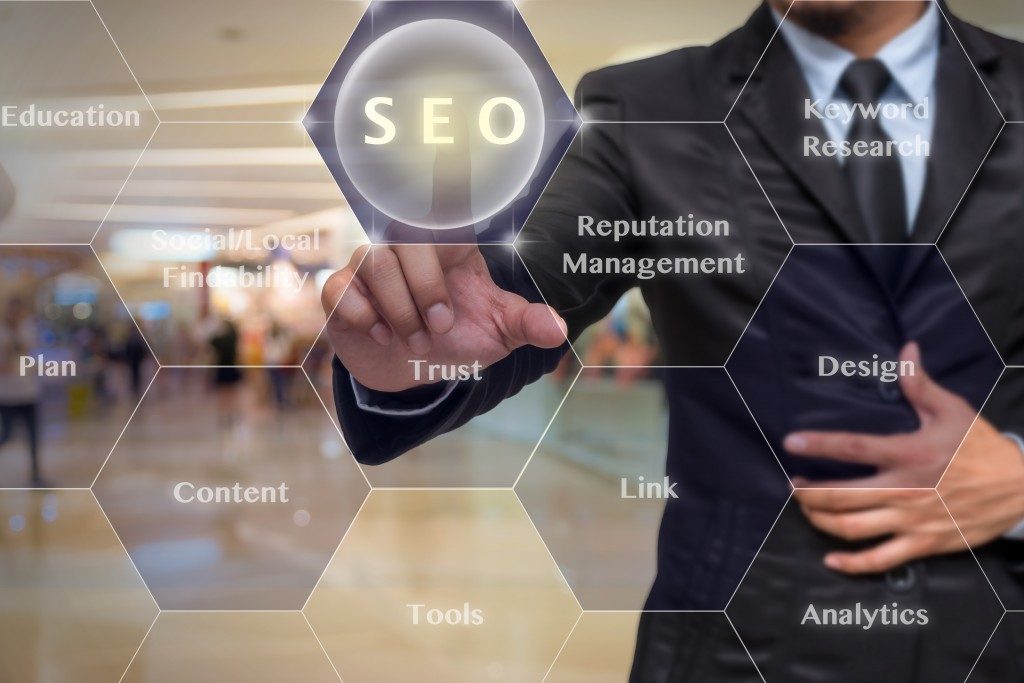 Businessman pressing SEO