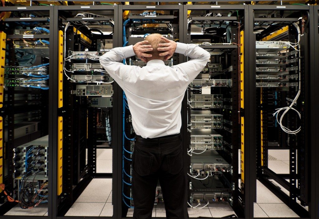 Man looking astonished in a network data center