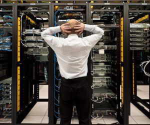 Man looking astonished in a network data center