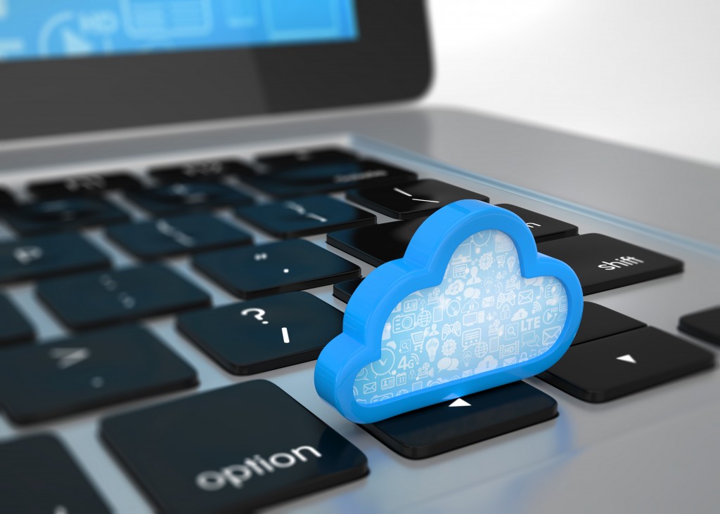 cloud miniature on top of a laptop keyboard